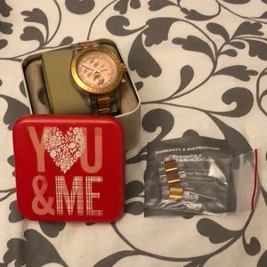 Rose gold and clear fossil watch